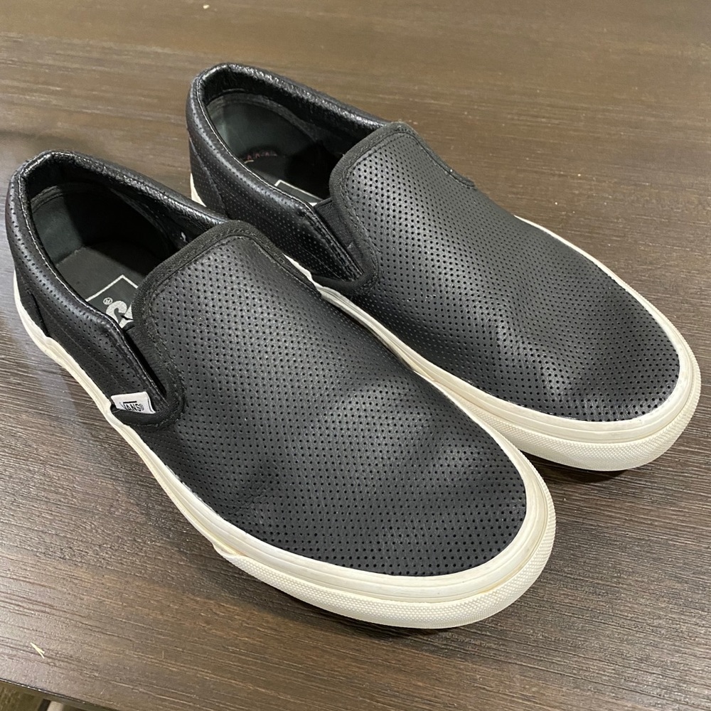 Vans black leather slip ons